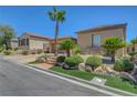 Single-story home featuring easy care landscaping, a desert theme, and a warm color palette at 2779 Kindeace Ave, Henderson, NV 89044