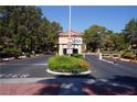 Community entrance gate with guard house and lush landscaping at 2851 S Valley View Blvd # 1134, Las Vegas, NV 89102