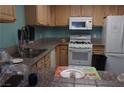 Functional kitchen features essential appliances, ample countertop space, and practical cabinetry at 2851 S Valley View Blvd # 1134, Las Vegas, NV 89102