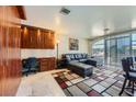 Spacious living area with modern furnishings, a built-in desk and plenty of natural light at 3111 Bel Air Dr # 201, Las Vegas, NV 89109