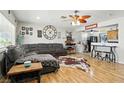 Inviting living room featuring hardwood floors, a comfortable sectional sofa, and an open layout at 517 5Th St, Boulder City, NV 89005