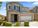 Charming two-story home featuring an attached two car garage in a suburban community at 5824 Gemstone Peak St, North Las Vegas, NV 89031