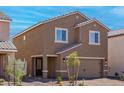 Exterior view showing neutral paint, low maintenance yard and drought tolerant landscaping at 6246 Blood Lily Ave, Las Vegas, NV 89122