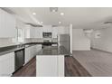 Bright kitchen featuring stainless appliances, quartz countertops and luxury vinyl flooring at 6246 Blood Lily Ave, Las Vegas, NV 89122