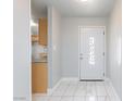 Bright entryway with white marble floors and a decorative front door at 6317 Alta Dr, Las Vegas, NV 89107