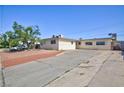 Charming single story home with an expansive driveway and well maintained exterior at 6317 Alta Dr, Las Vegas, NV 89107