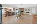 Open dining area with wood floors and access to kitchen and living spaces at 7113 Carrondale Way, Las Vegas, NV 89128