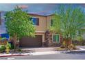 Charming two-story home features a two-car garage, stone accents, and a well-manicured front yard at 7733 Harthill Park Ave, Las Vegas, NV 89113