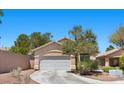 Charming single-story home with a two-car garage and desert landscaping at 8563 Red Diamond St, Las Vegas, NV 89123
