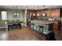 Spacious kitchen featuring an island, stainless steel appliances, and adjacent dining area at 10725 Wrigley Field Ave, Las Vegas, NV 89166