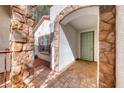 Inviting front porch with stone accents and decorative security door at 2154 Idaho Falls Dr, Henderson, NV 89044