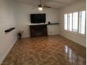 Bright living room boasts a fireplace and shuttered windows, creating a cozy and inviting atmosphere at 308 Sunbeam Dr, Las Vegas, NV 89107