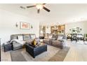 Open-concept living room with a dining area and seamless flow into the kitchen at 357 S Milan St, Henderson, NV 89015