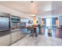 Sleek, stainless steel kitchen with marble floors seamlessly connects to the open-concept living area at 4381 W Flamingo Rd # 8304, Las Vegas, NV 89103