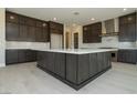 Spacious kitchen features a large island and stainless steel appliances at 4630 Blushing Dawn Ave, Las Vegas, NV 89118