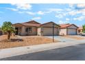 A well-maintained single-Gathering home with a two-car garage and xeriscaping at 4837 River Splash Ave, Las Vegas, NV 89131