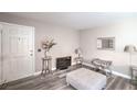Living room shows white door, hardwood floors and a sitting area at 5219 Caliente St # 11, Las Vegas, NV 89119