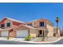 Charming two-story home with a well-maintained front yard, attached garage, and a beautiful desert landscape at 5516 Tantalum Ln, Las Vegas, NV 89122