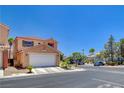 Well-maintained home with attached garage and desert landscaping on a sunny day at 5516 Tantalum Ln, Las Vegas, NV 89122