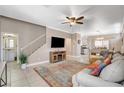 Bright and airy living area with neutral walls, tiled floors, a ceiling fan, and an open floor plan at 5516 Tantalum Ln, Las Vegas, NV 89122