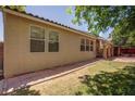 Secluded backyard featuring a covered patio and easy to maintain landscape at 5896 Shining Moon Ct, Las Vegas, NV 89131