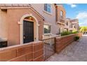Inviting townhome with a cozy front patio and well-kept exterior at 10013 Sable Point St, Las Vegas, NV 89178