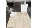 Home material selections shown: paint, vinyl plank flooring, quartz countertop, and kitchen faucet at 10275 Water Knot Ave, Las Vegas, NV 89166