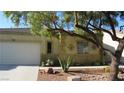 Charming single story home featuring xeriscaping, desert landscaping, and a two-car garage at 1504 Andrew David Ave, North Las Vegas, NV 89086