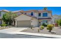 Charming two-story home features a two car garage, desert landscaping, and tile roof at 189 Andada Dr, Henderson, NV 89012