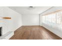 Bright living room featuring hardwood floors, neutral paint, and a large window at 1901 Manhattan Dr, Las Vegas, NV 89106