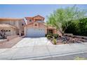 Charming two-story home with a well-maintained yard, desert landscaping, and a spacious two car garage at 2204 Brighton Shore St, Las Vegas, NV 89128