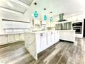 Spacious kitchen featuring an oversized island, stainless steel appliances, and modern pendant lighting at 2903 Hardin Dr, Henderson, NV 89074