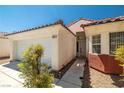Charming single-story home featuring a stucco facade, red tile roof, and well-maintained landscaping at 3597 Cherbourg Ave, Las Vegas, NV 89141