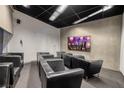 Modern home theater room with plush seating and a large screen for an immersive entertainment experience at 3722 Las Vegas Blvd # 2512 E, Las Vegas, NV 89158