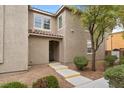 Home exterior showcasing the entryway with concrete steps leading to the front door at 390 Clarence House Ave # 1, North Las Vegas, NV 89032