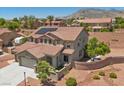 Aerial view of a beautiful two-story home with solar panels and well-manicured landscaping at 4021 Mountain Trek St, Las Vegas, NV 89129