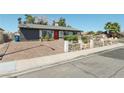A single-story home with brick driveway and stone-lined landscaping at 4027 Maple Hill Rd, Las Vegas, NV 89115
