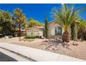 Well-maintained home with a palm tree and rock landscaping for easy maintenance at 4493 Rometta Ave, Las Vegas, NV 89141