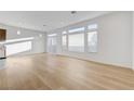 Bright and airy living room featuring beautiful hardwood floors and lots of natural light at 7775 Tyrell Peaks St, Las Vegas, NV 89139