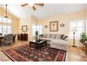 Inviting living room featuring high ceilings, tiled floors, and stylish furnishings at 8875 Tidal Bay Dr, Las Vegas, NV 89117