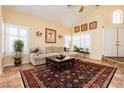 Inviting living room featuring high ceilings, tiled floors, and stylish furnishings at 8875 Tidal Bay Dr, Las Vegas, NV 89117