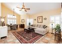 Inviting living room featuring high ceilings, tiled floors, and stylish furnishings at 8875 Tidal Bay Dr, Las Vegas, NV 89117