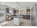 Modern kitchen with stainless steel appliances, granite countertops, and a large island at 9784 Kodiak Island Ct, Las Vegas, NV 89141