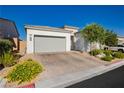 Charming single story home featuring a two car garage, desert landscaping, and bright stucco at , Las Vegas, NV 89166