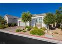 Charming single story home featuring a two car garage, desert landscaping, and bright stucco at , Las Vegas, NV 89166