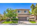 Charming two-story home features a well-manicured lawn and a spacious two-car garage at 11219 Playa Bonita Ave, Las Vegas, NV 89138