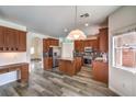 Modern kitchen with granite countertops, stainless steel appliances, and a central island at 11219 Playa Bonita Ave, Las Vegas, NV 89138