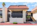 Charming condo exterior with a private balcony, tile roof, and a fenced yard, offering a cozy outdoor space at 1440 Vegas Valley Dr # 13, Las Vegas, NV 89169