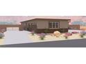 Charming single-story home featuring desert landscaping, three-car garage, and gated entrance at 1840 Old West Ave, Pahrump, NV 89048