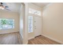 Inviting entryway with natural light, light wood-look flooring, and neutral paint at 1869 Desert Forest Way, Henderson, NV 89012
